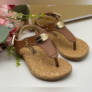 Michael Kors Girl’s Gold Tone Logo Plate Thong Sandals
